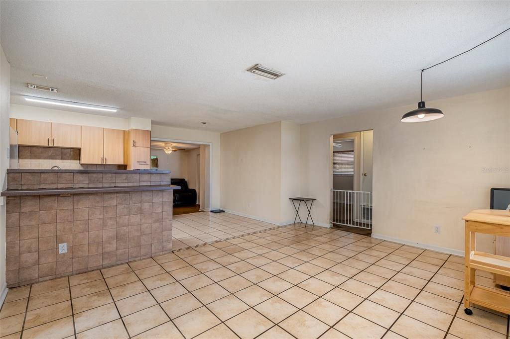 View of living room, dining room, kitchen