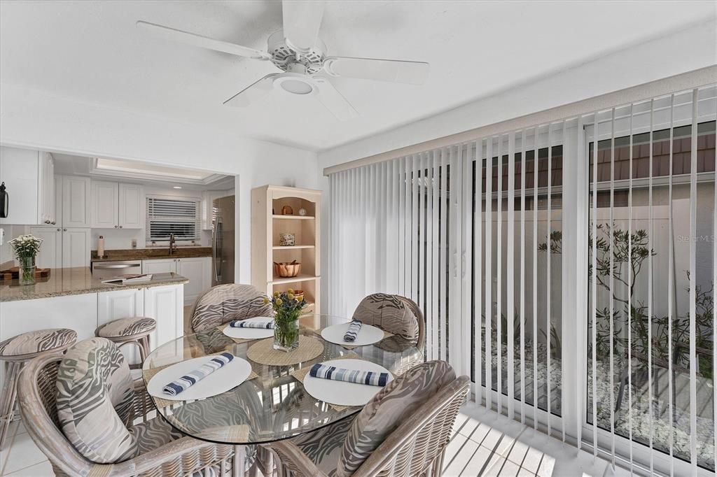 Dining Room with sliders to patio space for grilling