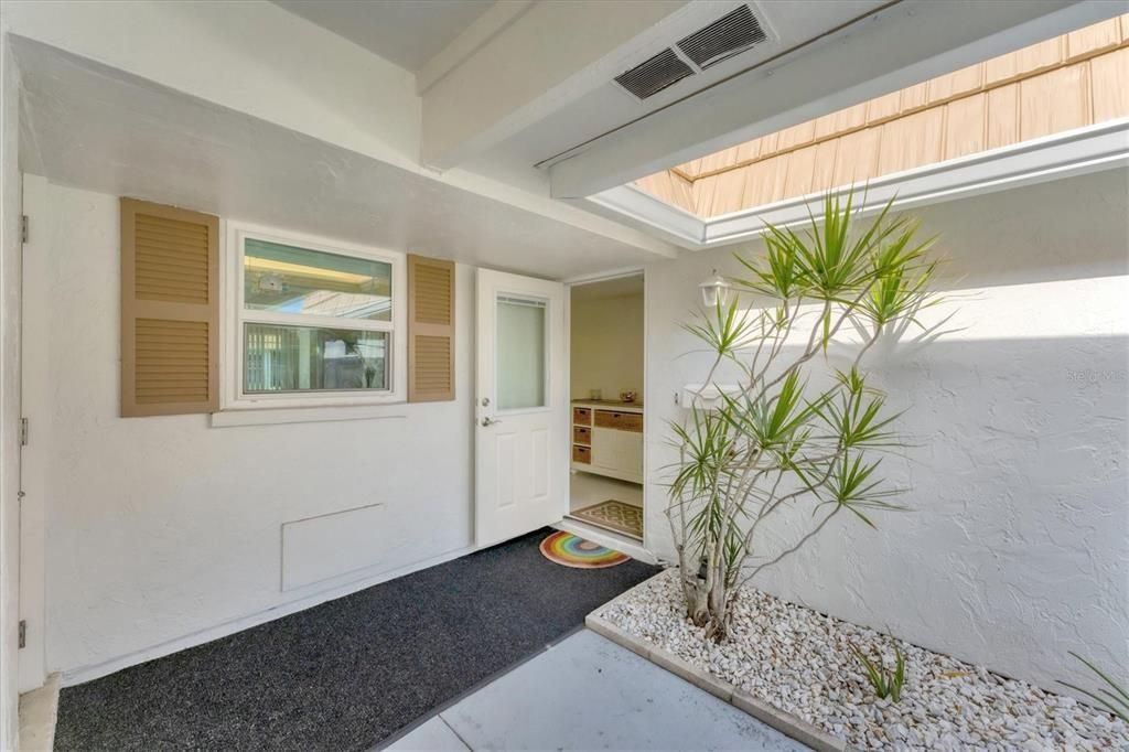 Entrance and kitchen window above sink