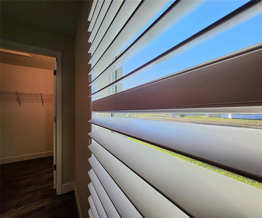 Guest bedroom 1, plantation shutters throughout the home