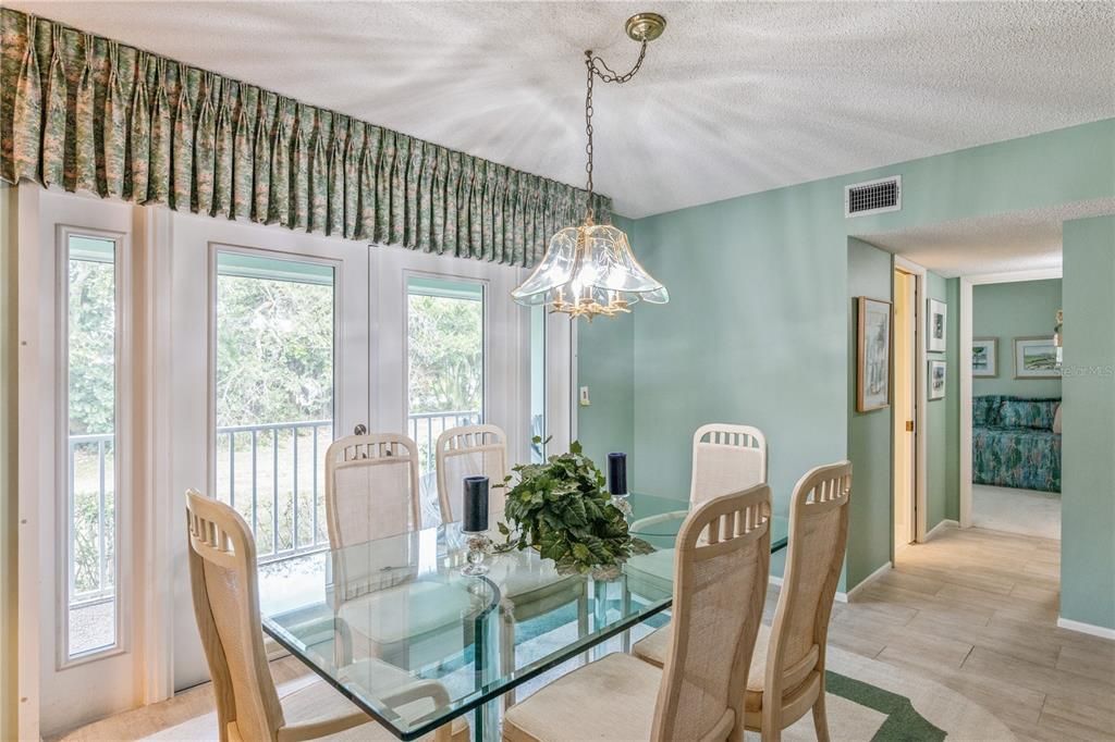 Formal dining room with side, screened lanai.