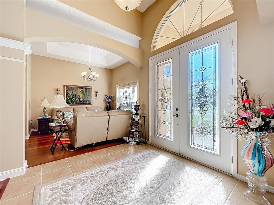 Walking in the foyer to your open floor plan through the double doors.