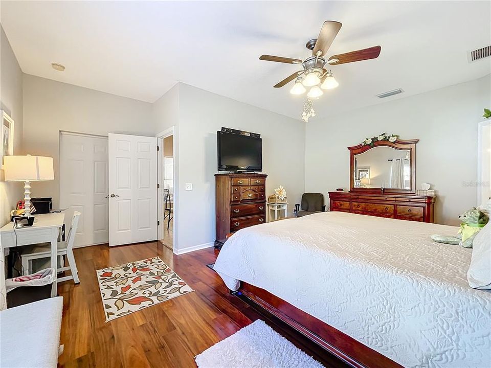 Primary bedroom with door to the rear porch.