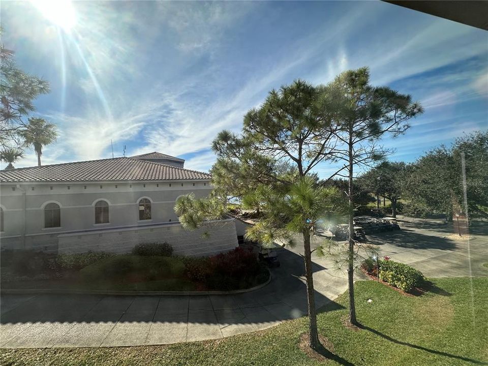 VIEW OF GOLF COURSE CLUBHOUSE FROM PRIMARY BEDROOM