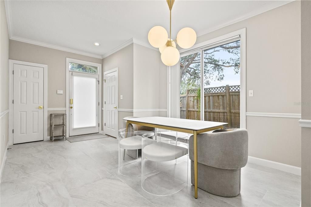 Dining area, coat closet and half bathroom