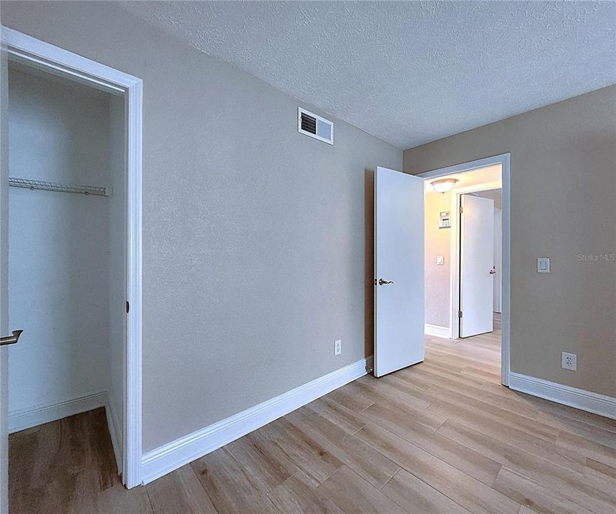 Guest Bedroom includes 2 closets: a walk-in & a built-in.