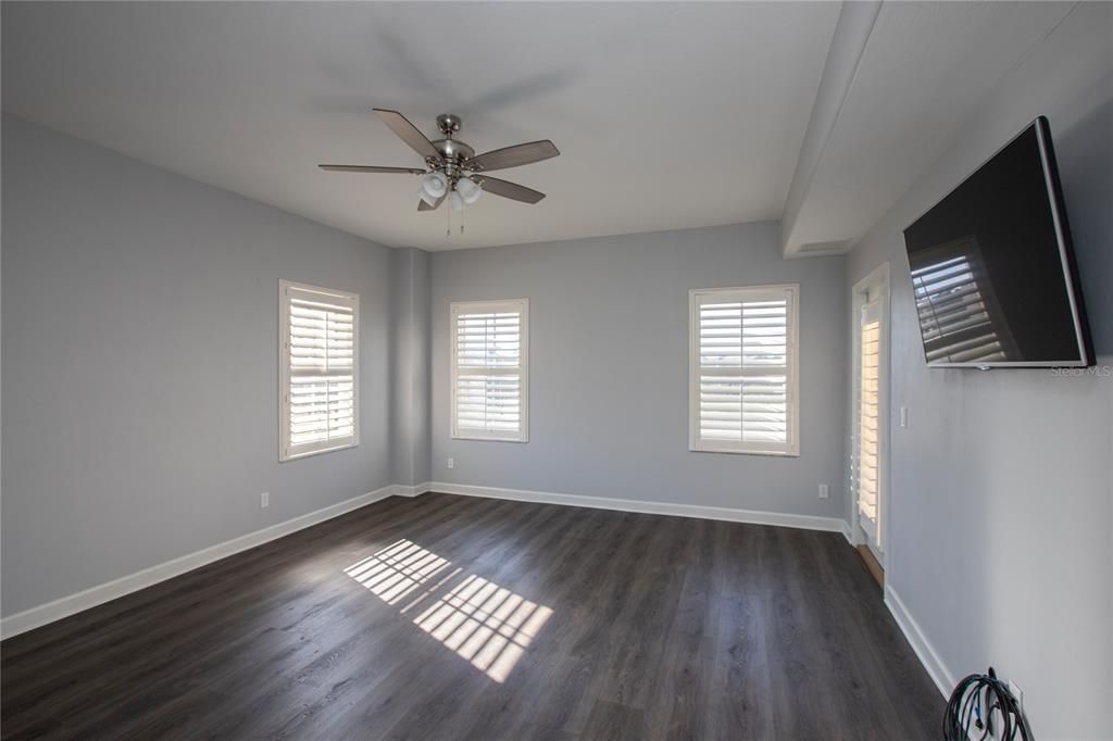 MASTER BEDROOM WITH WALL MOUNTED T.V.