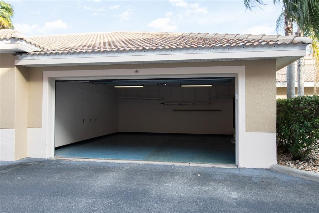 2 CAR GARAGE WITH SHELVING AND CUSTOM LIGHTING