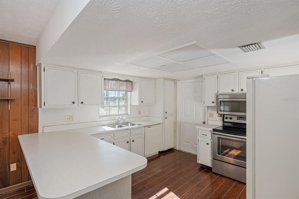 KITCHEN VIEW WITH DOOR TO GARAGE