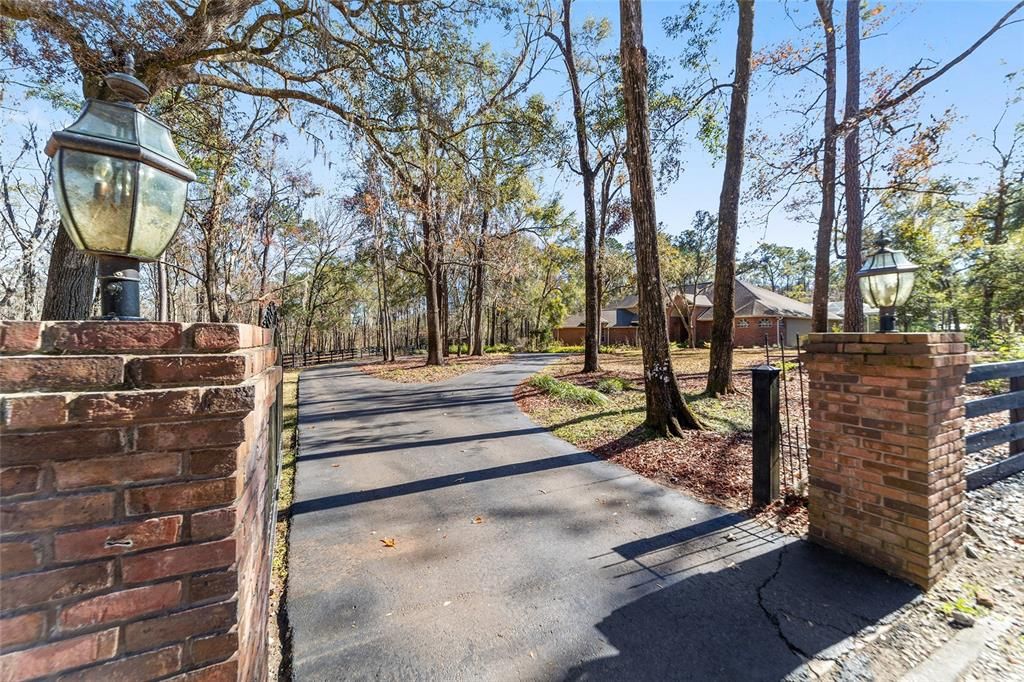 Second entry gate on the property circle driveway to the front entrance of home