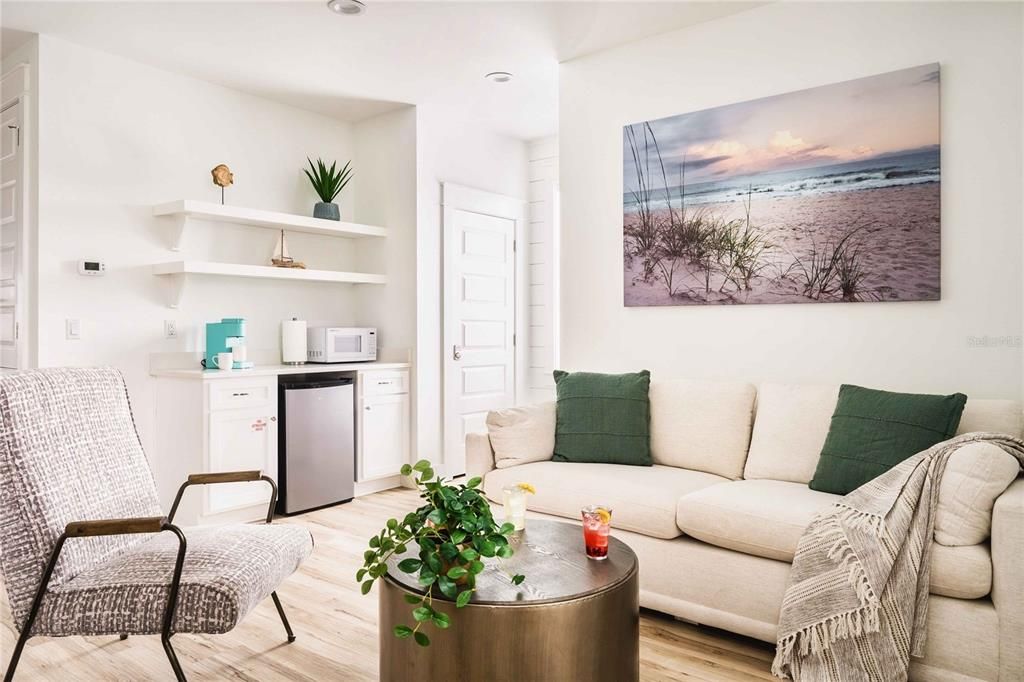 Second floor loft seating area with TV