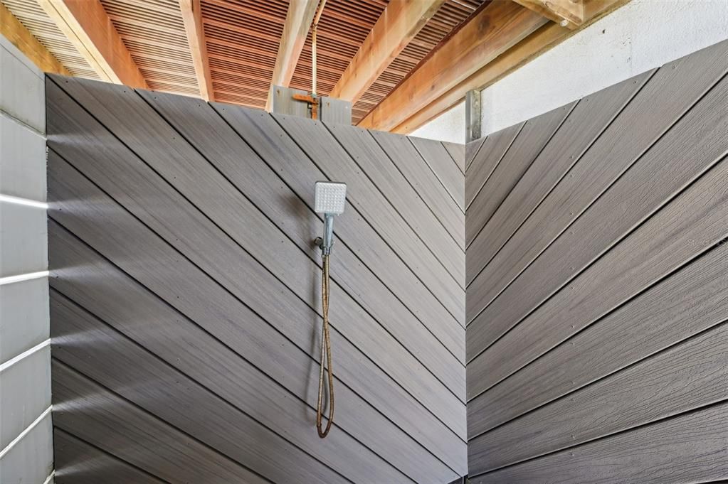 Outdoor shower over by the hot tub