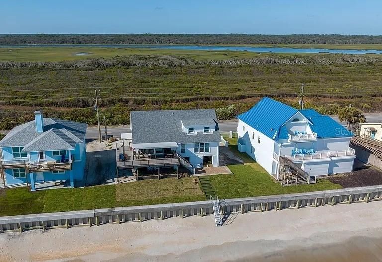 Protected by a seawall and neighboring seawalls.