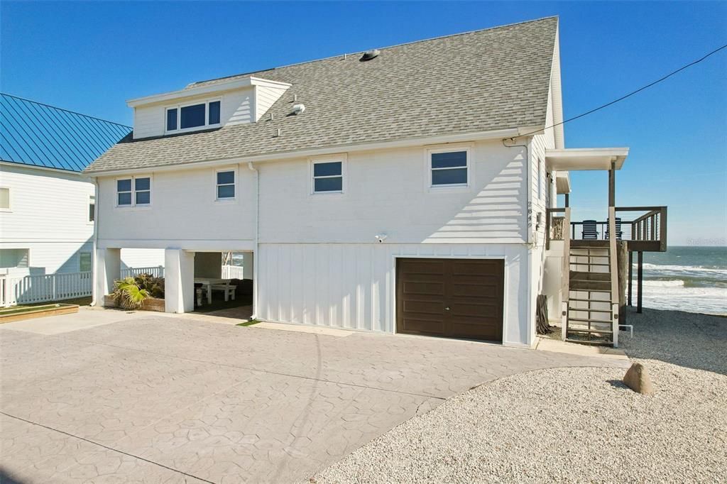 Spacious parking pad and 1 car garage