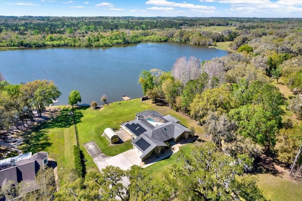 Aerial View of home with lake in the back