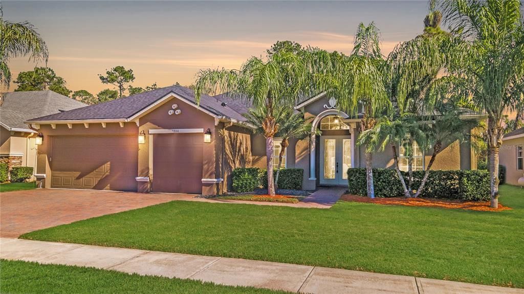 Gorgeous, Immaculate FIVE-BEDROOM, THREE-Bath, Concrete-Block Home with a THREE-CAR Garage and a Sparkling SCREENED POOL & Spa Backing to a Green CONSERVATION Area!  HOLY COW!