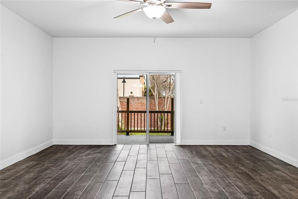 Great room sliding glass door leads to covered back porch and large back yard.