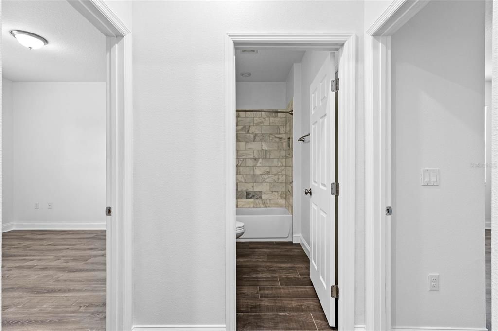 Guest bath situation in between bedrooms 3 and 4.