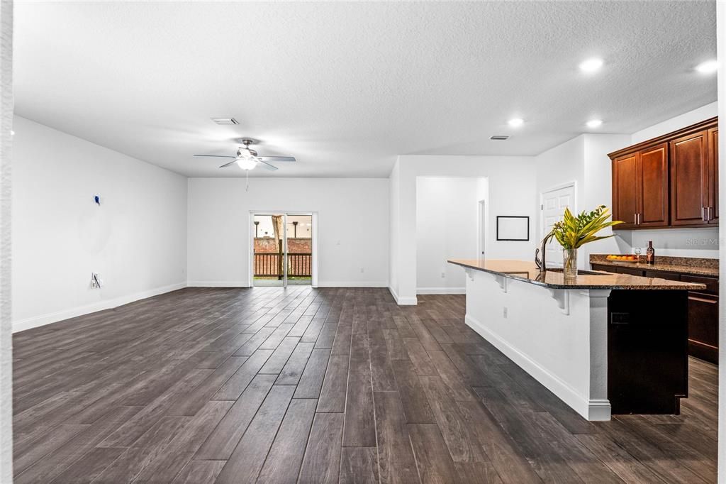 Large great room and dining area combo that is open to large kitchen.