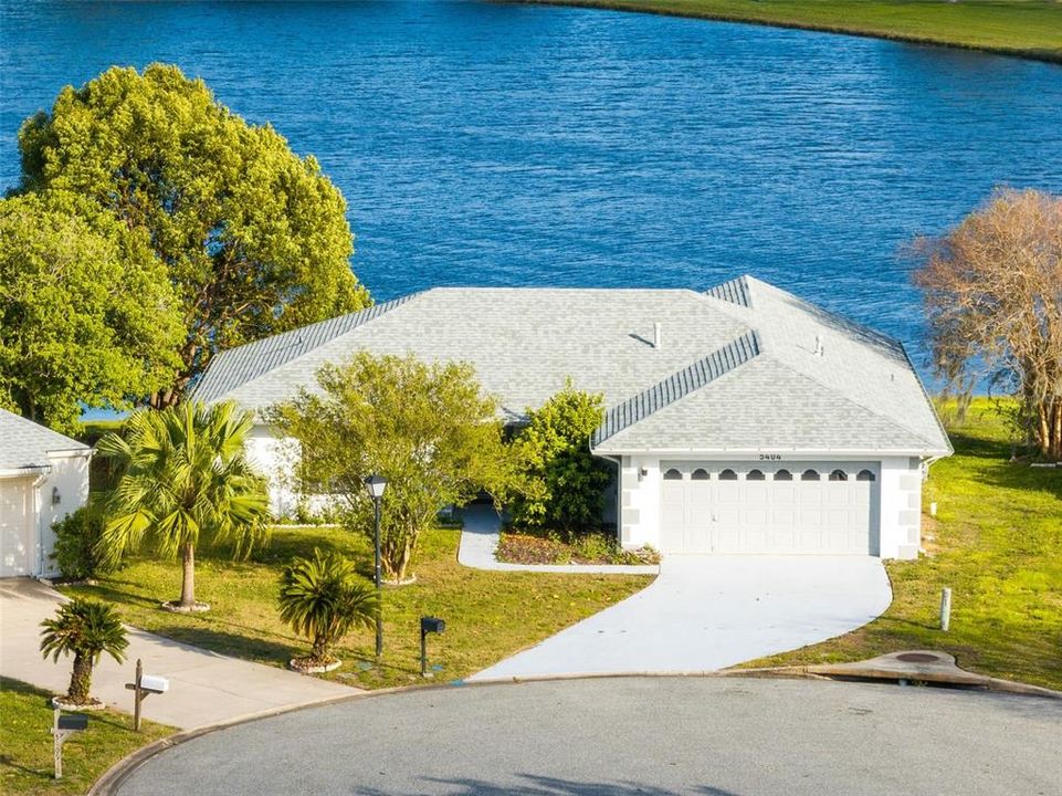 Welcome to your private luxury retreat in the highly sought-after Somerset Village of Williamsburg! This beautifully upgraded 2-bedroom, 2-bathroom home is nestled on a ¼-acre lot in a quiet cul-de-sac, offering stunning lake views and over $175K in high-end modern upgrades. In 2024, the kitchen and both bathrooms were completely gutted and rebuilt with luxury finishes, creating a truly move-in-ready home. Additional 2024-2025 upgrades include a brand-new roof (2025), gutters, re-plumbing, electrical wiring & panel, instant hot water heater, and a Halo 5 Whole-Home Water Purification System that provides clean, filtered water throughout the home. Other new enhancements include a new AC split unit in the sunroom, interior & exterior paint, lighting, ceiling fans, and spray foam attic insulation. A newer central AC unit (2021) ensures year-round comfort.