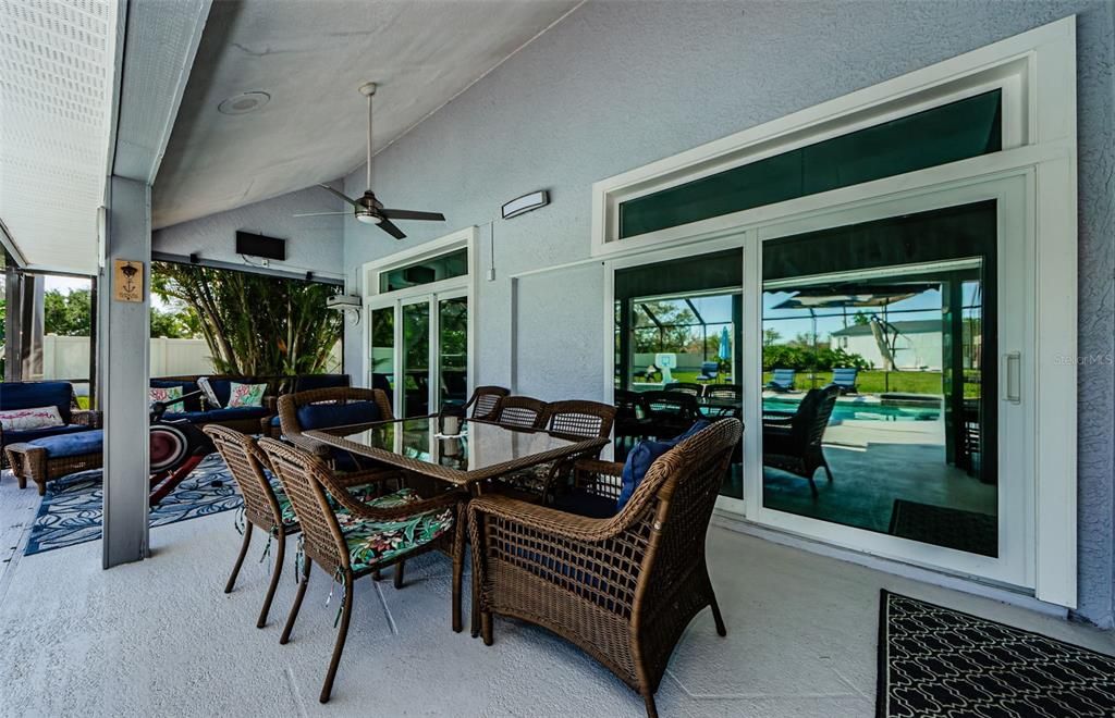 Terrace outside living room and master bedroom, under roof, and at poolside.  New sliding doors and overhead transome glass