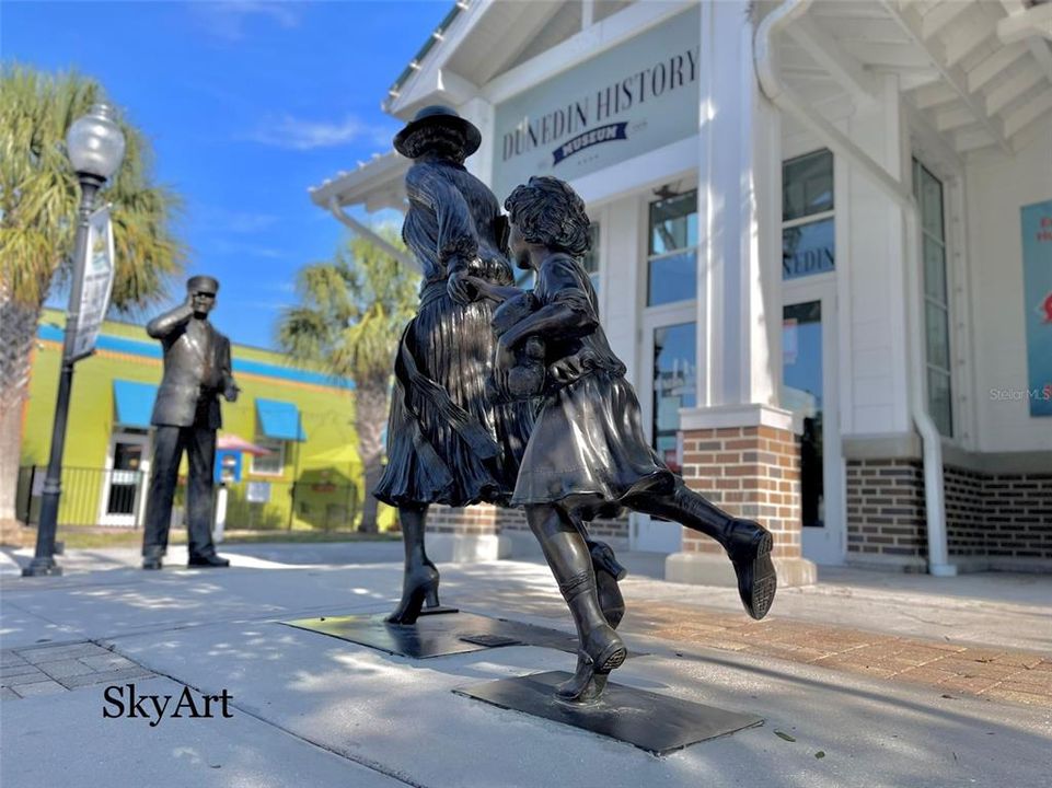 Statues in front of Dunedin Historical Museum paid for by long time former member, supporter and trustee Melba Rilott.