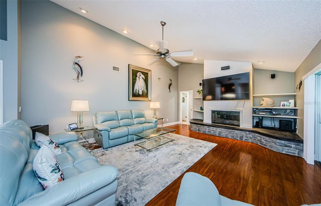 Large family room with remodeled fireplace and converted to gas.  Cathedral ceilings, gorgeous wood laminate flooring.