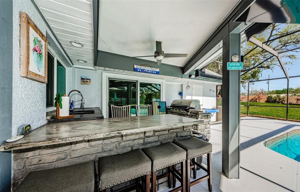 Outdoor kitchen at pool.