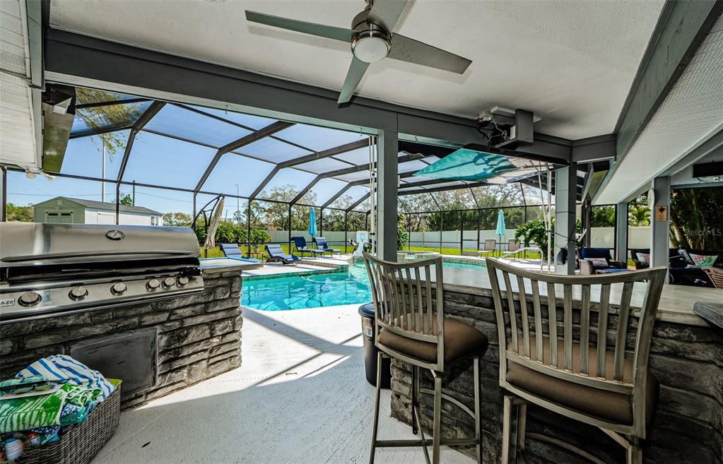 Outdoor kitchen at pool.