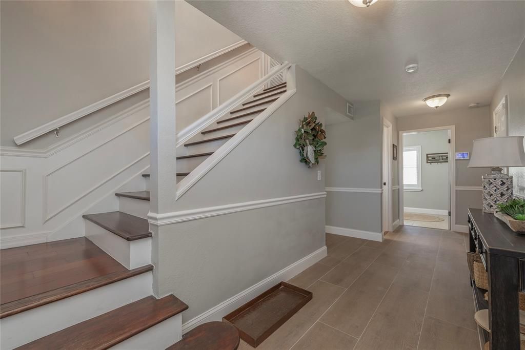 Lower-level with one Living Room, Half Bathroom and Laundry Room