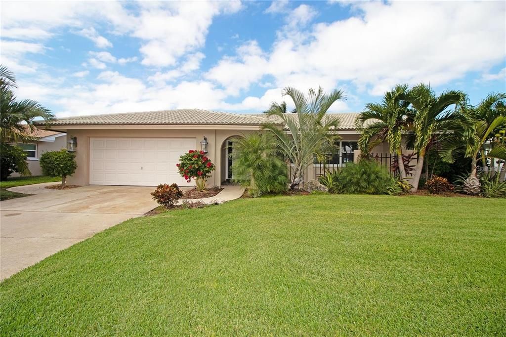 Gorgeous waterfront home with lush landscaping and direct access to Tampa Bay!
