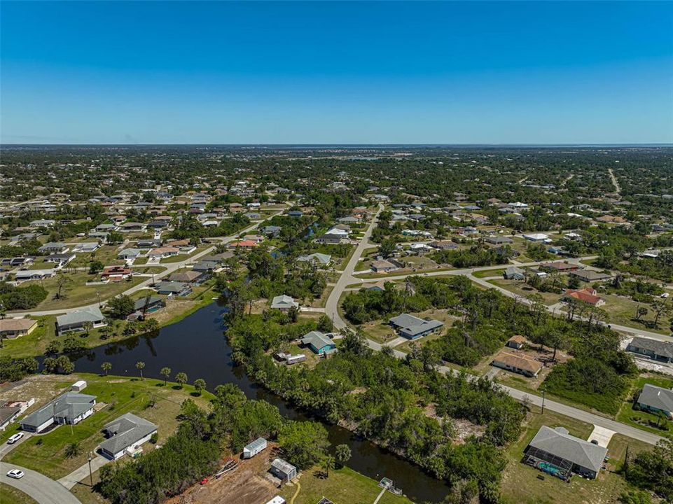 Nestled in a quiet, well-maintained neighborhood, this spacious lot backs directly to a serene canal