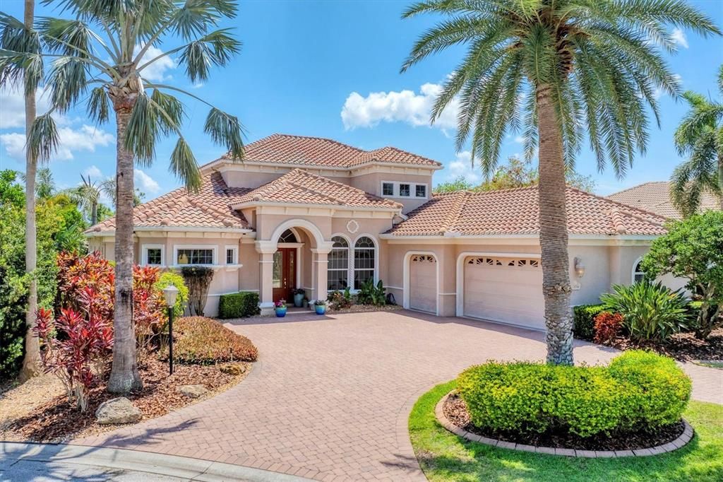 Custom Todd Johston home with circular paver driveway