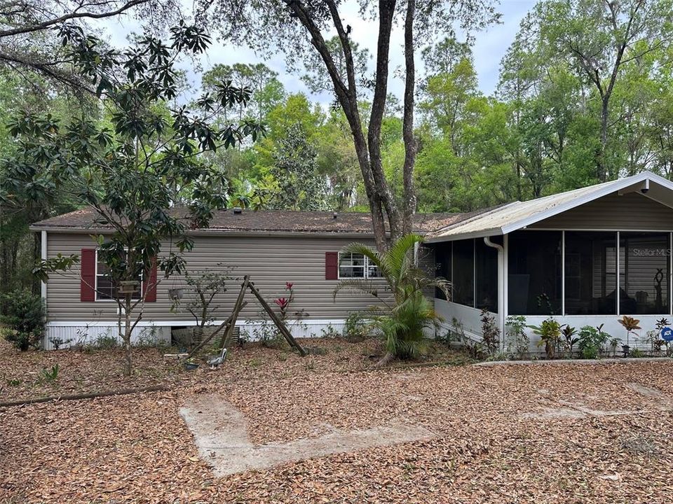 Left window is bedroom 3 and right window is the kitchen.