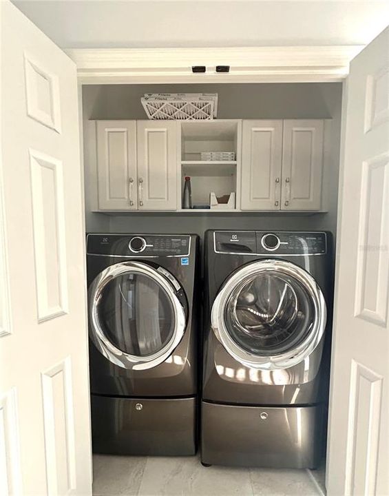 upstair Laundry - front load Washer / Dryer and storage