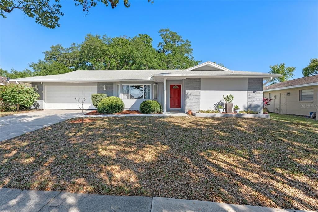 611 Green Briar Blvd Exterior. Freshly painted. Situated on elevated 0.21 ACRE lot.