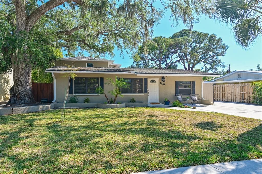 Special home with 2 driveways, 2 entrances. First you have a potential 4 bedroom, 3 bathroom home. The second home is a fully equipped studio ready for a traveling nurse, in laws, or teen suite. Perfect set up for Airbnb with zero HOA and weekly rentals allowed by City of SRQ