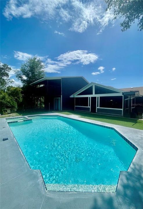 Pool with new tiles and turf