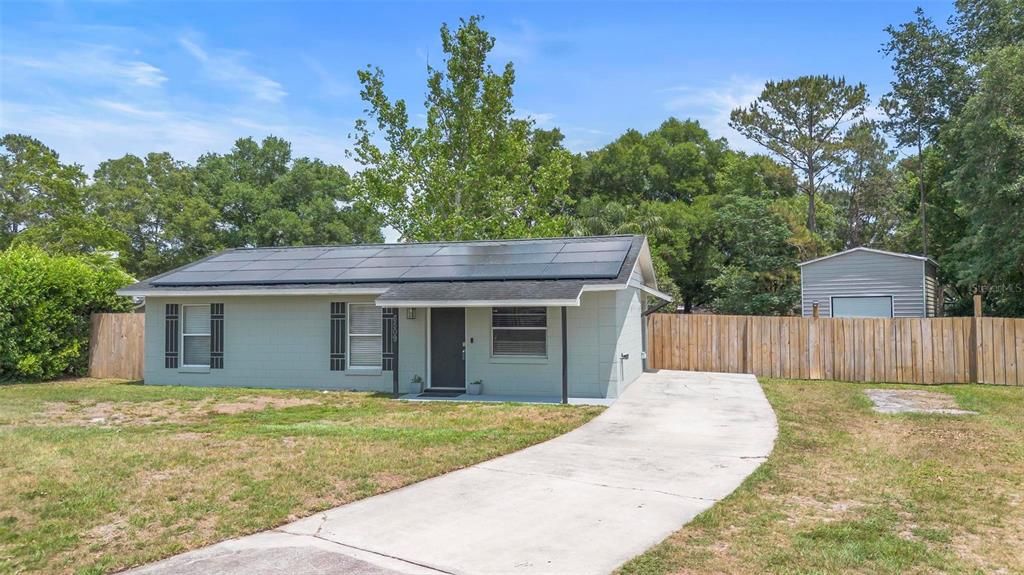 3/1 home with massive workshop in huge fenced back yard.