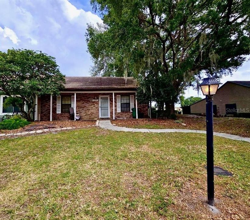 Maintenance free brick villa welcomes you with Rocking chair front porch!