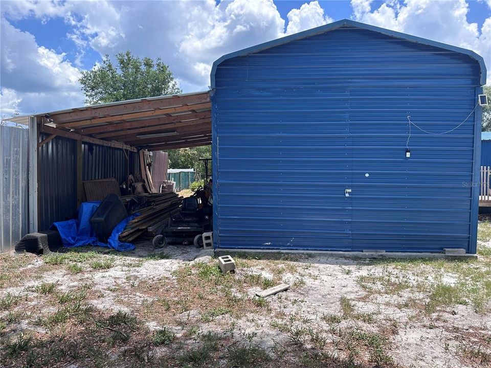Huge detached shed and lean-to.
