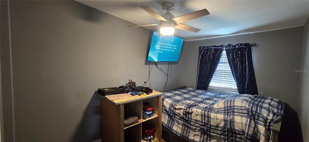 On opposing side of the house is the guest bedroom.