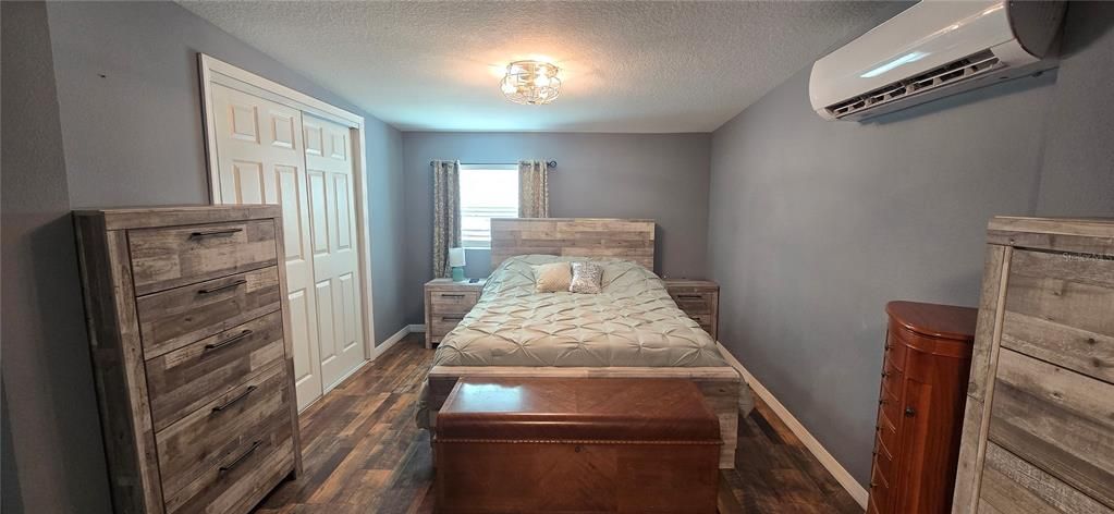 The primary bedroom with a walk in closet.
