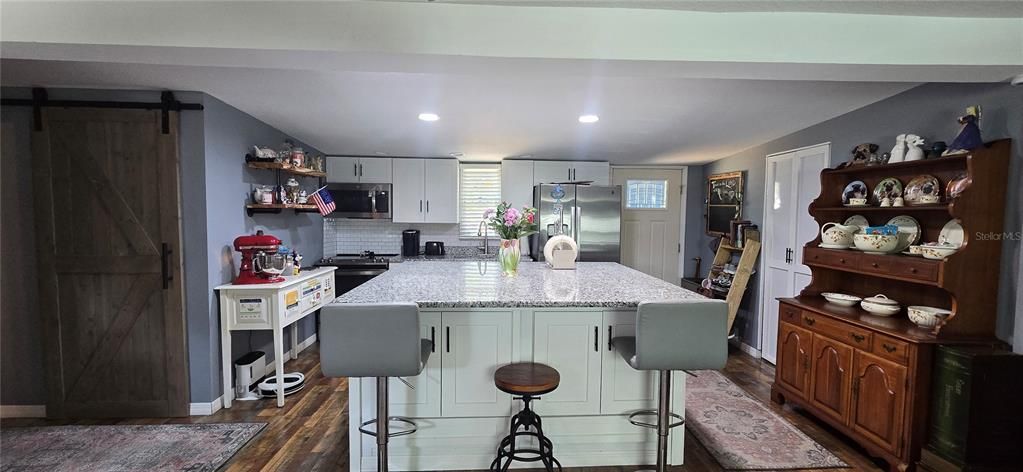 A wide angle of the glorious kitchen.