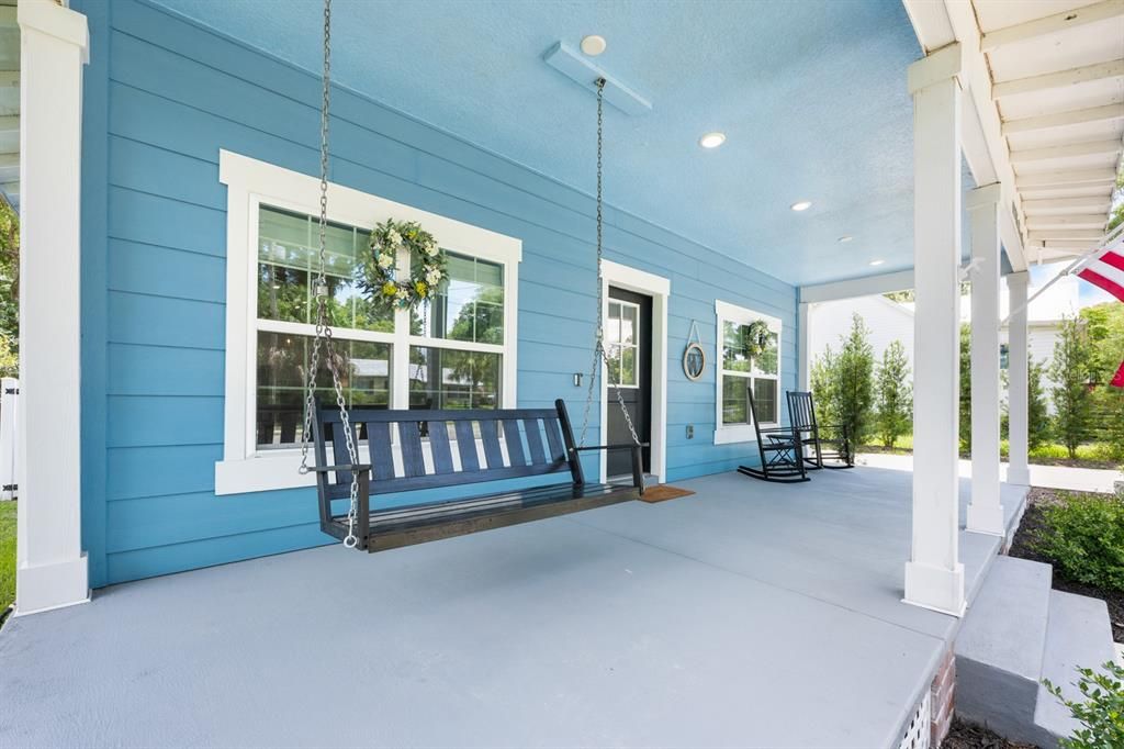 You'll love the LARGE COVERED FRONT PORCH, complete with a swing—perfect for relaxing and enjoying the peaceful, friendly neighborhood.