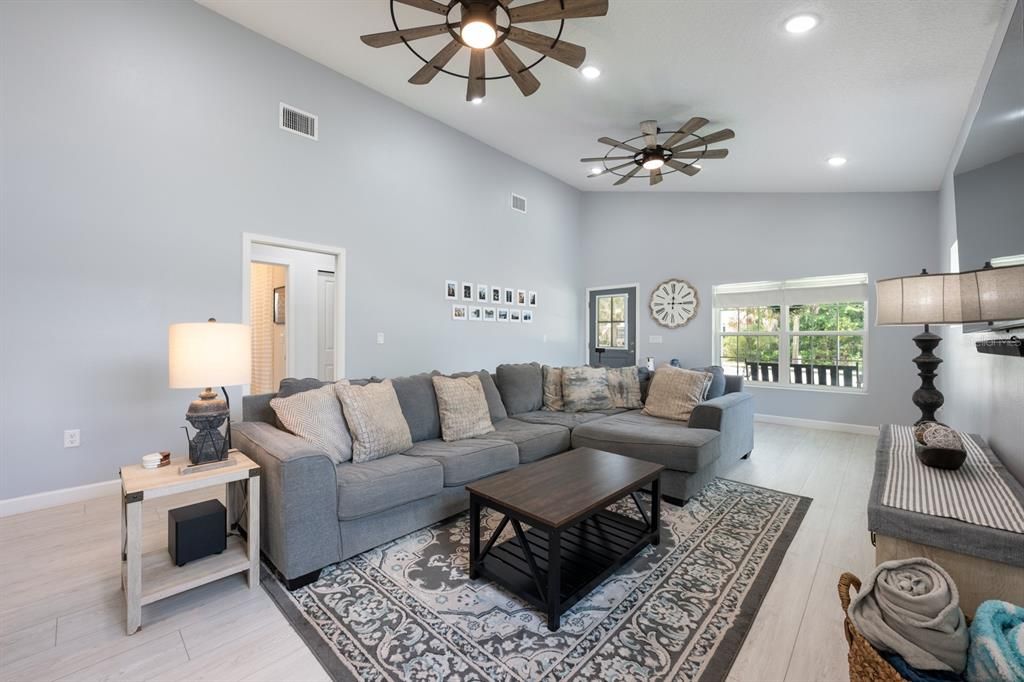 Just FOUR YEARS YOUNG, this beautifully designed home features vaulted ceilings and an abundance of DOUBLE-PANE WINDOWS that fill the interior with natural light.