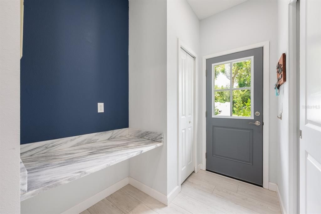 A convenient Mud room connects through sliding doors to the Laundry room.