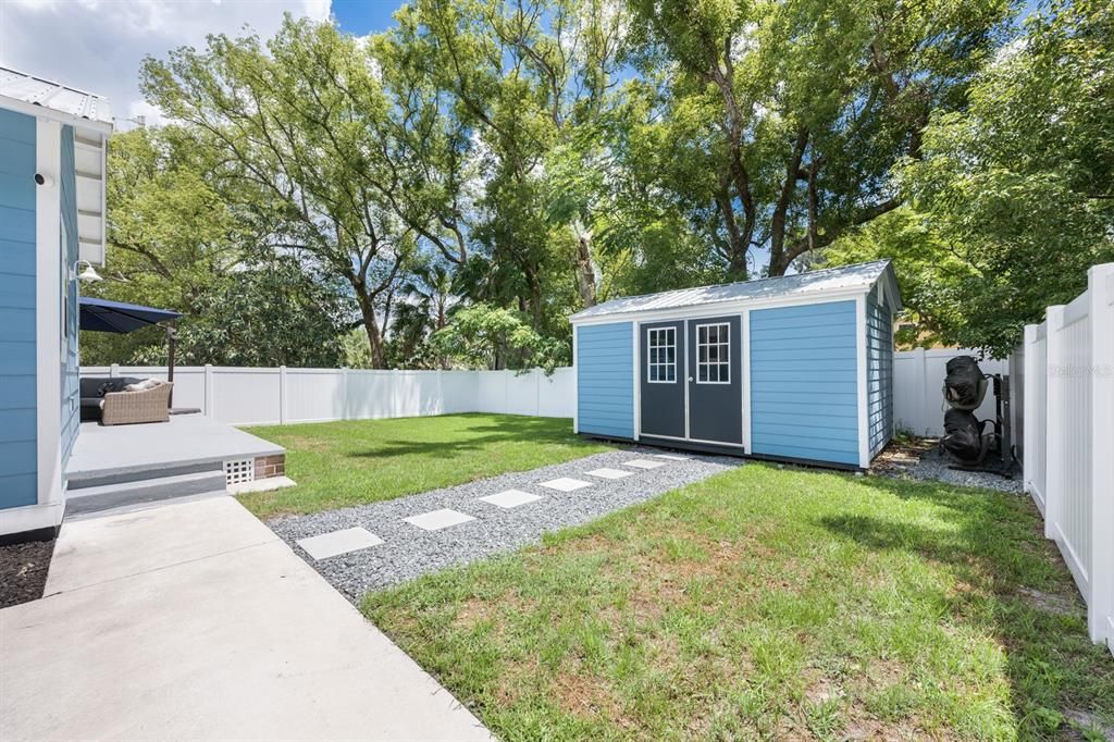 A convenient Storage Shed provides a practical solution for keeping lawn equipment and garden tools neatly organized.