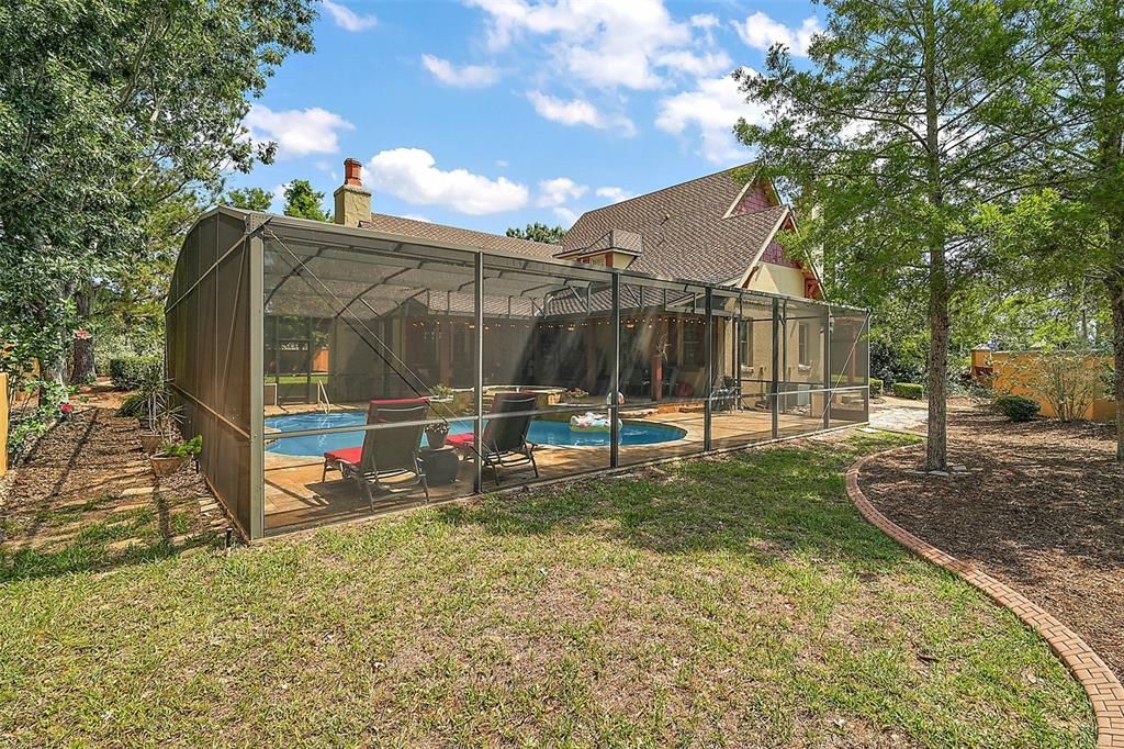 backyard view showing landscape curbing