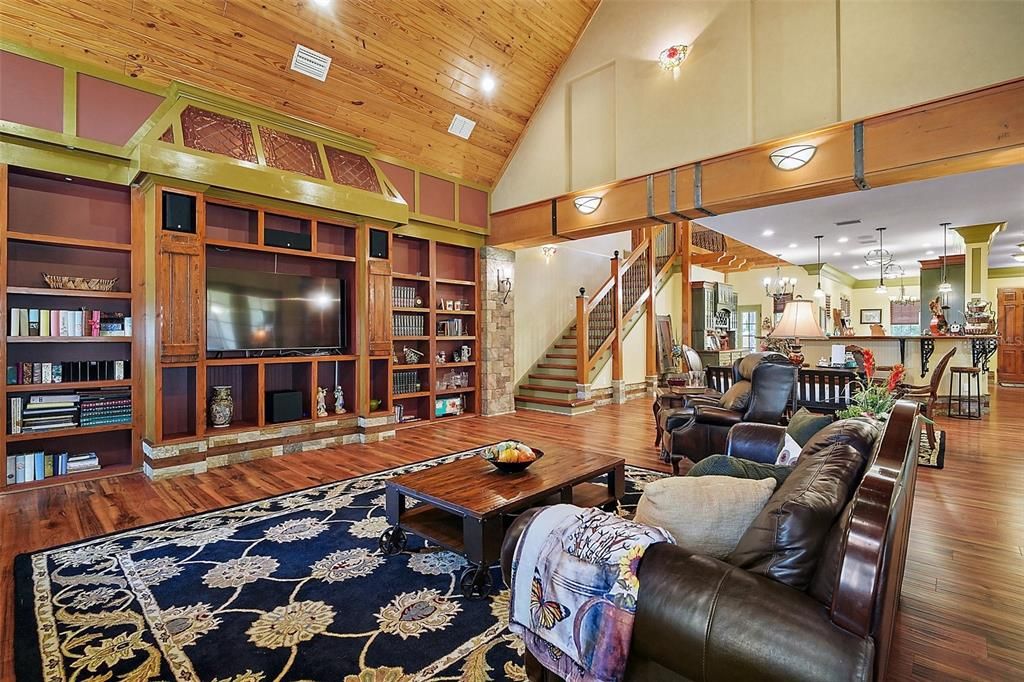 The built in shelving adds both function (secret door) and charm to this cozy great room